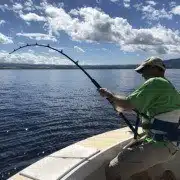 IMG_5228-min Fisherman catching north shore sport fish, Oahu. Flyer offers the best Hawaii fishing charters.